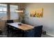 Dining room featuring a large wooden table and six chairs at 41262 W Almira Dr, Maricopa, AZ 85138