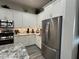 Modern kitchen with stainless steel appliances and granite countertops at 41262 W Almira Dr, Maricopa, AZ 85138