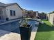 Blue rectangular pool with a wooden pergola at 41262 W Almira Dr, Maricopa, AZ 85138