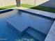 Relaxing rectangular pool with light beige tile at 41262 W Almira Dr, Maricopa, AZ 85138