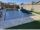 Inviting rectangular pool with a spacious patio and pergola at 41262 W Almira Dr, Maricopa, AZ 85138