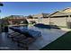 Stunning pool with a waterfall feature and lounge chairs at 41262 W Almira Dr, Maricopa, AZ 85138