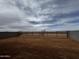 Large backyard featuring block and iron fencing with expansive desert views beyond at 4328 E Bradford Ave, San Tan Valley, AZ 85140