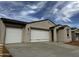 Charming single-story home featuring a three car garage and neutral stucco exterior at 4328 E Bradford Ave, San Tan Valley, AZ 85140