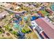 Stunning aerial view of community pools, bocce ball court, recreation center, and well-maintained landscaping at 4439 E Ficus Way, Gilbert, AZ 85298