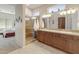 Bathroom showcasing a glass shower enclosure and double sink vanity at 4439 E Ficus Way, Gilbert, AZ 85298