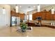 Kitchen with an island, stainless steel appliances, and rich wood cabinetry at 4439 E Ficus Way, Gilbert, AZ 85298