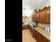 Kitchen with wood cabinetry, stainless appliances and tile flooring at 4439 E Ficus Way, Gilbert, AZ 85298