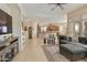 Comfortable living room with a ceiling fan and large windows, creating a cozy and bright atmosphere at 4439 E Ficus Way, Gilbert, AZ 85298