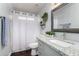 This bathroom features a shower, granite countertop, modern fixtures, and decorative accents at 4507 E Towne Ln, Gilbert, AZ 85234