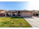 Charming home featuring a well-manicured lawn and a two-car garage at 4507 E Towne Ln, Gilbert, AZ 85234