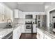 Bright kitchen with white cabinets, stainless steel appliances, and granite counters at 4507 E Towne Ln, Gilbert, AZ 85234