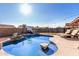 Backyard pool and patio area with lounge chairs offers a refreshing outdoor living space with privacy fencing at 4507 E Towne Ln, Gilbert, AZ 85234