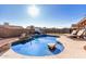 Backyard pool and patio area with lounge chairs offers a refreshing outdoor living space with privacy fencing at 4507 E Towne Ln, Gilbert, AZ 85234