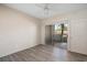 Bedroom with wood-look floors and sliding glass door to patio at 4644 N 22Nd St # 1017, Phoenix, AZ 85016