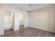 Bright bedroom with wood-look floors, private bath, and walk-in closet at 4644 N 22Nd St # 1017, Phoenix, AZ 85016