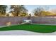 Relaxing backyard with artificial turf and a swing at 5840 S Pico St, Gilbert, AZ 85298