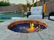 Cozy fire pit area next to the swimming pool at 5840 S Pico St, Gilbert, AZ 85298