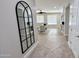 Bright hallway with a large mirror reflecting light into the living area at 5840 S Pico St, Gilbert, AZ 85298