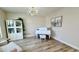 Spacious living room featuring a grand piano and modern chandelier at 5840 S Pico St, Gilbert, AZ 85298