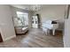 Bright living room with a grand piano and large window at 5840 S Pico St, Gilbert, AZ 85298