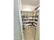 Well-organized walk-in pantry features tiled floors, ample shelving, and multiple food storage containers at 5840 S Pico St, Gilbert, AZ 85298