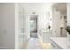 Modern bathroom with marble vanity, glass shower, and walk-in closet at 6166 N Scottsdale Rd # C2008, Paradise Valley, AZ 85253