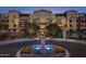 Luxury apartment building with fountain and landscaping at 6166 N Scottsdale Rd # C2008, Paradise Valley, AZ 85253