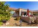 Landscaped backyard with gravel and desert plants at 6615 W Sandpiper Ct, Florence, AZ 85132