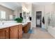 Double vanity bathroom with soaking tub, shower, and walk-in closet at 6615 W Sandpiper Ct, Florence, AZ 85132