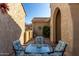 Charming courtyard with a glass top table at 6615 W Sandpiper Ct, Florence, AZ 85132