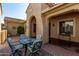 Side courtyard with seating and a metal cart at 6615 W Sandpiper Ct, Florence, AZ 85132