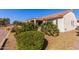 House exterior with lush green landscaping and desert plants at 6615 W Sandpiper Ct, Florence, AZ 85132