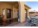 Relaxing front patio with seating and decorative elements at 6615 W Sandpiper Ct, Florence, AZ 85132