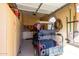 Garage interior with golf cart, American flag, and storage cabinets at 6615 W Sandpiper Ct, Florence, AZ 85132