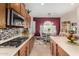 Well-equipped kitchen with stainless steel appliances and ample counter space at 6615 W Sandpiper Ct, Florence, AZ 85132