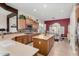 Spacious kitchen featuring island, stainless steel appliances, and ample cabinetry at 6615 W Sandpiper Ct, Florence, AZ 85132