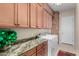 Laundry room with washer, dryer, and upper cabinets at 6615 W Sandpiper Ct, Florence, AZ 85132