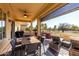 Patio furniture and table on a covered patio, overlooking a golf course at 6615 W Sandpiper Ct, Florence, AZ 85132