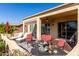 Relaxing patio with lounge chairs and a golf course view at 6615 W Sandpiper Ct, Florence, AZ 85132