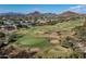 Aerial view of a luxury home community with a golf course and mountain views at 7130 E Saddleback St # 11, Mesa, AZ 85207