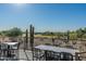 Outdoor patio with tables and chairs overlooking golf course at 7130 E Saddleback St # 11, Mesa, AZ 85207