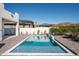 Relaxing rectangular pool with paved patio and landscaping at 7130 E Saddleback St # 11, Mesa, AZ 85207