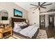 Main bedroom with high ceiling and ensuite bathroom at 7439 E Beryl Ave, Scottsdale, AZ 85258