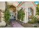 Elegant entryway with double doors and lush landscaping at 7439 E Beryl Ave, Scottsdale, AZ 85258