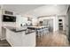 Modern kitchen with white cabinets, a large island, and stainless steel appliances at 7439 E Beryl Ave, Scottsdale, AZ 85258