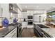 Modern kitchen with stainless steel appliances and a large island at 7439 E Beryl Ave, Scottsdale, AZ 85258