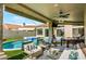 Relaxing patio with pool, fire pit, and seating area at 7439 E Beryl Ave, Scottsdale, AZ 85258