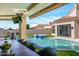 Patio with pool view, dining table, and comfortable seating at 7439 E Beryl Ave, Scottsdale, AZ 85258