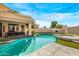 Freeform swimming pool with a spa and outdoor dining area at 7439 E Beryl Ave, Scottsdale, AZ 85258